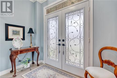 Foyer entrance with crown molding and french doors - 26 Summerberry Way, Hamilton, ON - Indoor Photo Showing Other Room