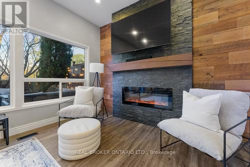 179 - 2050 Upper Middle Road, Burlington, ON - Indoor Photo Showing Living Room With Fireplace