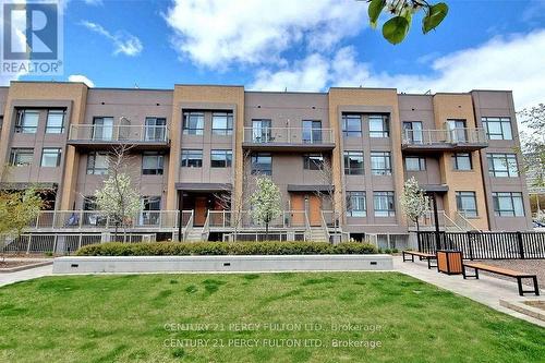 315 - 90 Orchid Place Drive, Toronto, ON - Outdoor With Balcony With Facade