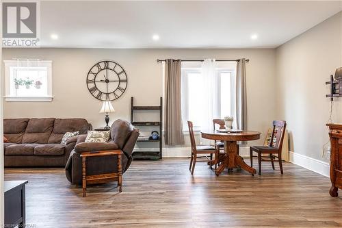 Living room featuring wood-type flooring - 175 Mcnab St, Stratford, ON - Indoor