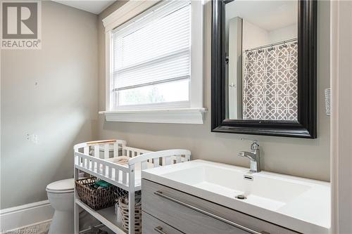 Bathroom with a shower with shower curtain, vanity, and toilet - 175 Mcnab St, Stratford, ON - Indoor Photo Showing Bathroom