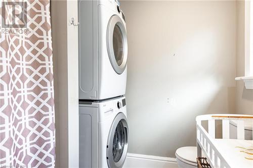 Laundry area with stacked washer and dryer - 175 Mcnab St, Stratford, ON - Indoor Photo Showing Laundry Room