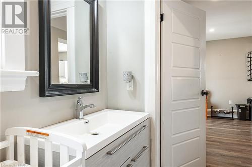 Bathroom with hardwood / wood-style floors and vanity - 175 Mcnab St, Stratford, ON - Indoor Photo Showing Bathroom