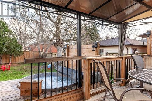 Wooden terrace featuring a gazebo and a hot tub - 175 Mcnab St, Stratford, ON - Outdoor With Deck Patio Veranda With Exterior