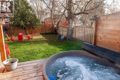 View of yard featuring a jacuzzi and a deck - 175 Mcnab St, Stratford, ON - Outdoor