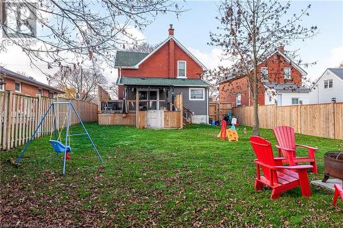 Rear view of property with a lawn and a playground - 175 Mcnab St, Stratford, ON - Outdoor