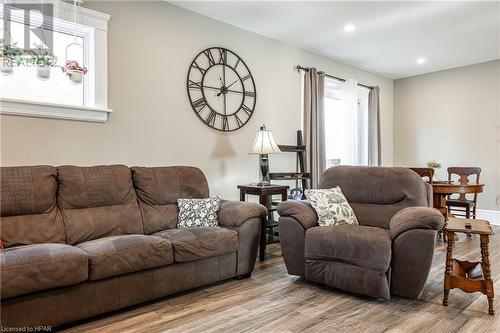 Living room featuring plenty of natural light and light hardwood / wood-style flooring - 175 Mcnab St, Stratford, ON - Indoor Photo Showing Living Room