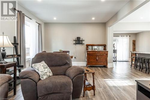 Living room with a healthy amount of sunlight and light hardwood / wood-style flooring - 175 Mcnab St, Stratford, ON - Indoor Photo Showing Living Room