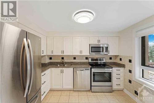 960 Teron Road Unit#211, Ottawa, ON - Indoor Photo Showing Kitchen With Double Sink