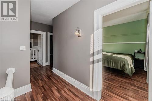 Hallway featuring dark wood-type flooring - 20 Sarah Street, Brantford, ON - Indoor