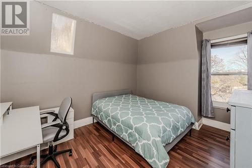 Bedroom featuring dark hardwood / wood-style flooring - 20 Sarah Street, Brantford, ON - Indoor Photo Showing Bedroom