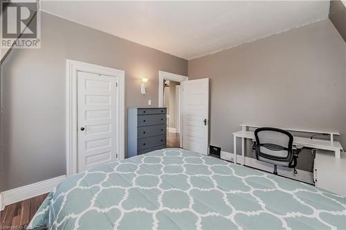 Bedroom featuring wood-type flooring and a closet - 20 Sarah Street, Brantford, ON - Indoor Photo Showing Bedroom