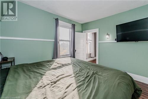 Bedroom with hardwood / wood-style flooring - 20 Sarah Street, Brantford, ON - Indoor Photo Showing Bedroom