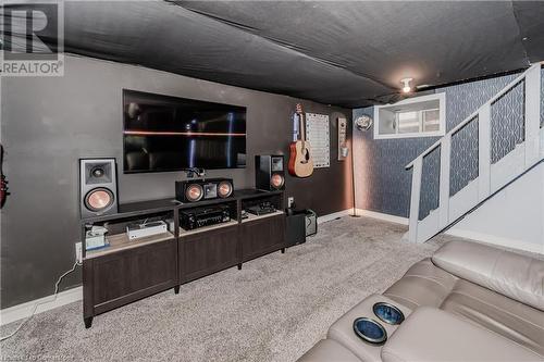 Home theater featuring light carpet - 20 Sarah Street, Brantford, ON - Indoor