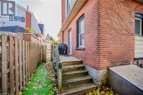 View of home's exterior with a deck - 20 Sarah Street, Brantford, ON - Outdoor With Exterior