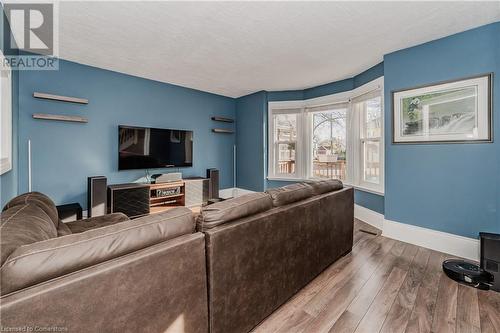 Living room with hardwood / wood-style flooring and a textured ceiling - 20 Sarah Street, Brantford, ON - Indoor Photo Showing Living Room