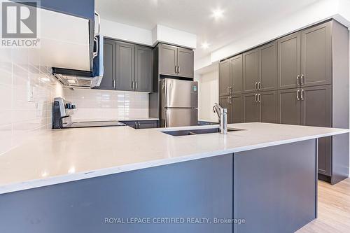 63 - 99 Roger Street, Waterloo, ON - Indoor Photo Showing Kitchen With Double Sink