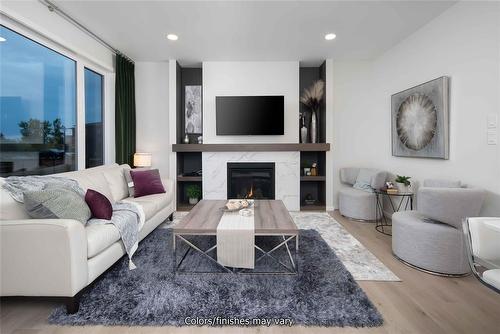 24 Barnes Place, West St Paul, MB - Indoor Photo Showing Living Room With Fireplace