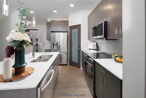 24 Barnes Place, West St Paul, MB - Indoor Photo Showing Kitchen With Double Sink With Upgraded Kitchen