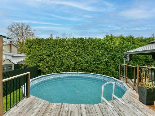 Piscine - 63 18E Avenue, Sainte-Marthe-Sur-Le-Lac, QC - Outdoor With Above Ground Pool With Backyard