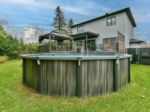 Face arriÃ¨re - 63 18E Avenue, Sainte-Marthe-Sur-Le-Lac, QC - Outdoor With Above Ground Pool