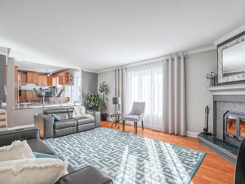 Salon - 924 Rue De La Richardière, Boucherville, QC - Indoor Photo Showing Living Room With Fireplace