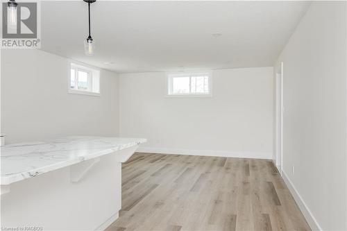 Basement with a healthy amount of sunlight and light wood-type flooring - 323 Mclean Crescent, Saugeen Shores, ON - Indoor Photo Showing Other Room