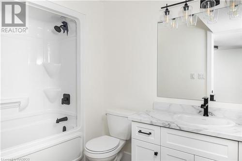 Full bathroom featuring toilet, vanity, and bathing tub / shower combination - 323 Mclean Crescent, Saugeen Shores, ON - Indoor Photo Showing Bathroom