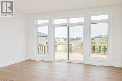 Living room with light wood-type flooring and a wealth of natural light - 323 Mclean Crescent, Saugeen Shores, ON - Indoor Photo Showing Other Room