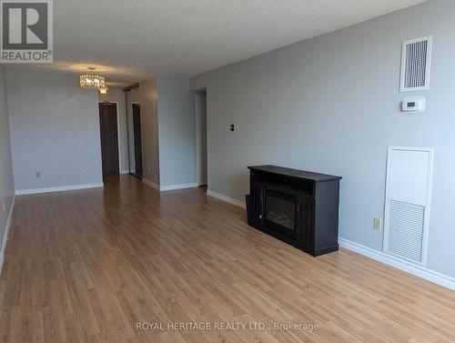 401 - 44 Falby Court, Ajax, ON - Indoor Photo Showing Living Room With Fireplace