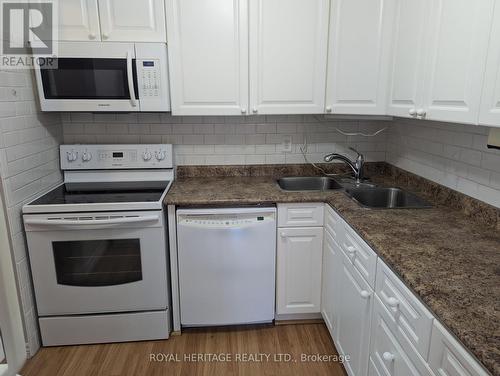 401 - 44 Falby Court, Ajax, ON - Indoor Photo Showing Kitchen With Double Sink