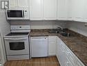 401 - 44 Falby Court, Ajax, ON  - Indoor Photo Showing Kitchen With Double Sink 