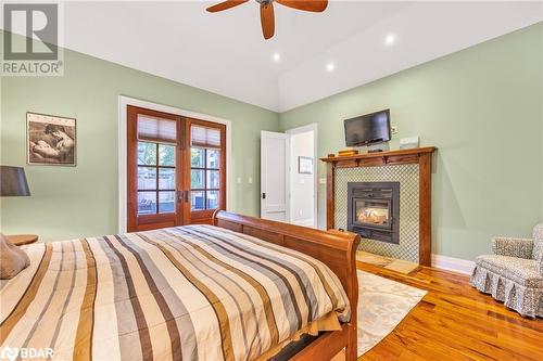 3967 Guest Road, Innisfil, ON - Indoor Photo Showing Bedroom With Fireplace