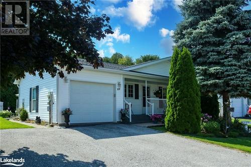 Ranch-style home with covered porch and a garage - 69 St James Place, Wasaga Beach, ON - Outdoor