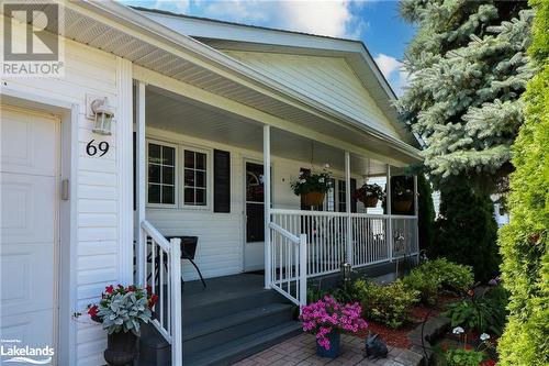 Property entrance with a porch - 69 St James Place, Wasaga Beach, ON - Outdoor With Deck Patio Veranda