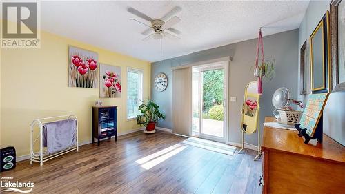 Doorway featuring hardwood / wood-style flooring, ceiling fan, and a textured ceiling - 69 St James Place, Wasaga Beach, ON - Indoor Photo Showing Other Room