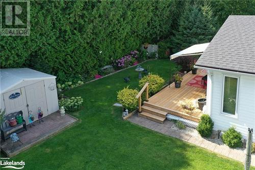 View of yard featuring a shed and a deck - 69 St James Place, Wasaga Beach, ON - Outdoor