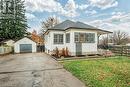 View of side of home featuring a lawn, an outbuilding, and a garage - 72 Elgin Street S, Cambridge, ON  - Outdoor 