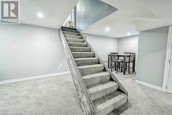 Staircase featuring carpet floors - 