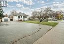 View of front of property with an outdoor structure, a front yard, and a garage - 72 Elgin Street S, Cambridge, ON  - Outdoor 