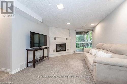 Bsmnt - 604 Glen Forrest Boulevard, Waterloo, ON - Indoor Photo Showing Living Room With Fireplace