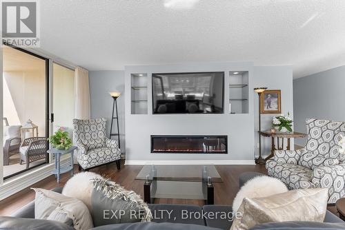 1008 - 3 Towering Hts Boulevard, St. Catharines (461 - Glendale/Glenridge), ON - Indoor Photo Showing Living Room With Fireplace