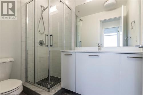 Bathroom with a shower with door, vanity, and toilet - 479 Charlton Avenue E Unit# 404, Hamilton, ON - Indoor Photo Showing Bathroom