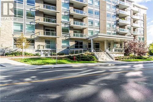 View of building exterior - 479 Charlton Avenue E Unit# 404, Hamilton, ON - Outdoor With Balcony With Facade