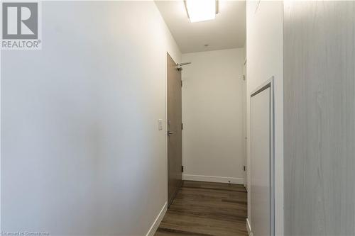 Hall featuring dark wood-type flooring - 479 Charlton Avenue E Unit# 404, Hamilton, ON - Indoor Photo Showing Other Room