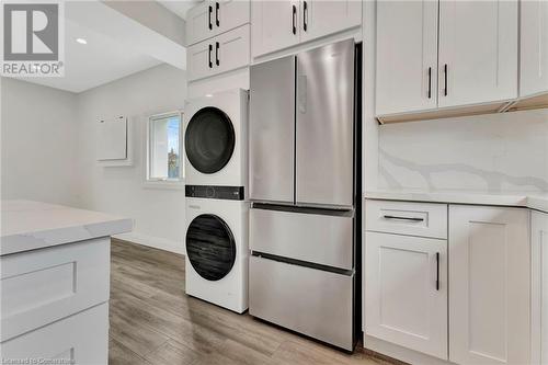 Built-In Laundry in the ADU - 306 Paling Avenue, Hamilton, ON - Indoor Photo Showing Laundry Room