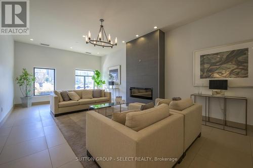 610 - 240 Villagewalk Boulevard, London, ON - Indoor Photo Showing Living Room With Fireplace