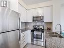 907 - 840 Queens Plate Drive, Toronto, ON  - Indoor Photo Showing Kitchen With Double Sink With Upgraded Kitchen 