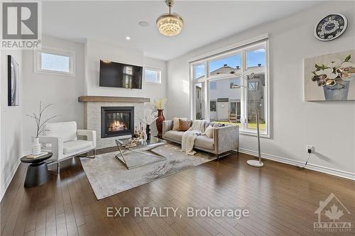 62 Viceroy Mews, Ottawa, ON - Indoor Photo Showing Living Room With Fireplace