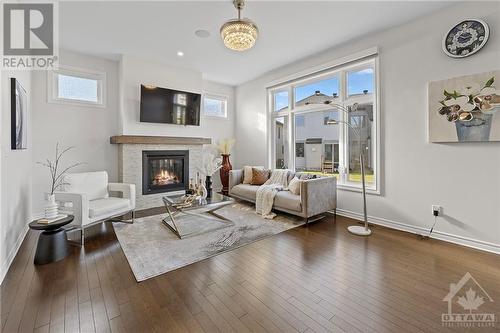 LIVING ROOM - 62 Viceroy Mews, Ottawa, ON - Indoor Photo Showing Living Room With Fireplace